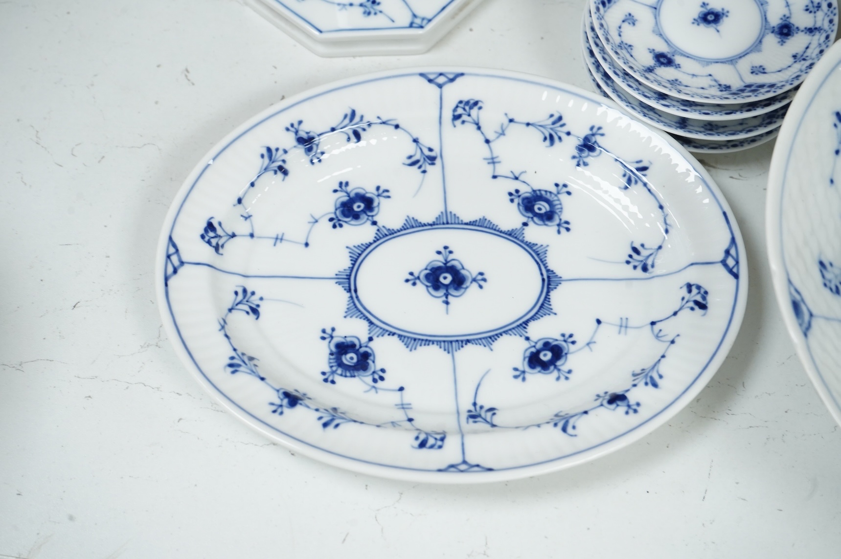 A collection of Royal Copenhagen and Bing & Grondahl onion pattern blue and white tableware